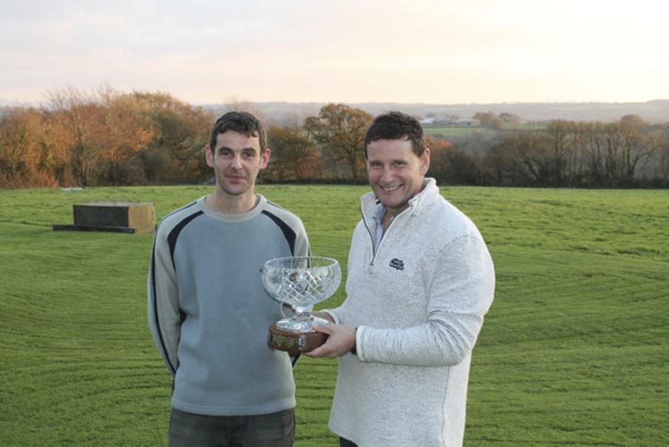 Matt Gill presenting the Denis Gill memorial trophy to his uncle Kevin