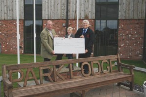 L to R: Tom Bayston, proprietor, Park Lodge Shooting School and his son William Bayston present the cheque to Bob Smailes, regional fundraising manager, Yorkshire Air Ambulance.