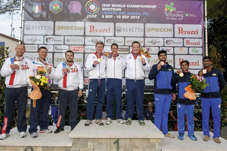 LONATO - SEPTEMBER 14: (L-R) Silver medalist Team of the Russian Federation (Vasily MOSIN, Vitaly FOKEEV, Artem NEKRASOV), Gold medalist Team of Great Britain (Tim KNEALE, Matthew John COWARD-HOLLEY, Matthew FRENCH) and Bronze medalist Team of India (Asab MOHD, Ankur MITTAL, Sangram DAHIYA) pose with their medals after the Double Trap Men Event at the Olympic Shooting Range "Trap Concaverde" during Day 4 of the ISSF World Championship Shotgun on September 14, 2015 in Lonato, Italy. (Photo by Nicolo Zangirolami)